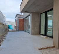 An unfinished terrace at a villa in the city of Vodice with an incomplete facade and glass.