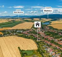 Aerial view of a family house in Kozárovce, surrounded by fields and nature.