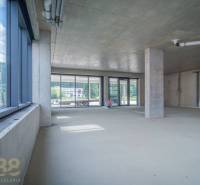 Unfurnished commercial spaces with glass doors, high ceilings, and a view to the exterior.