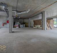 Future commercial premises with building materials and pipe installation in Svit.