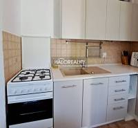Kitchen in a 3-room apartment with a stove and a sink.
