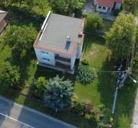A family house in Rakoľuby, Nové Mesto nad Váhom, surrounded by a garden and neighborhood.