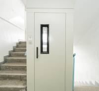Staircase and elevator doors in an office building.