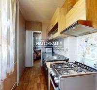 Kitchen in a 2-room apartment with a stove and kitchen unit.