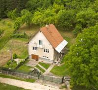 A family house in Papradno with a large garden and green surroundings.