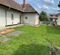 A family house in Trenčianske Stankovce with a well-maintained lawn and a traditional sloped roof.