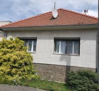 A family house in Topoľčianky with a gable roof and a satellite dish.