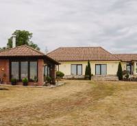 Family house on Kopanice Street in Krupina with a terrace and a garden on dry grass.