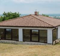 A family house in Krupina on Kopanice with a sloped roof and panoramic windows.