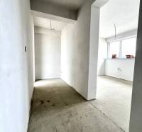 Hallway in a family house, white walls, large window, preparation for electrical installation.