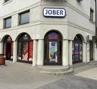 Komárno, Petőfi Street, commercial premises with advertising boards and multiple entrances.
