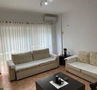 A comfortable living space with two sofas in a holiday apartment.