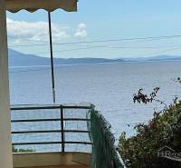 View from a holiday apartment in Saranda of the sea with mountains in the distance.
