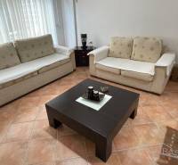 Living room in a holiday apartment with two sofas and a coffee table.