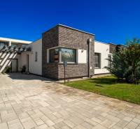 A family house on Richtarsko Pole in Galanta with a garden and a landscaped walkway.