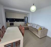 Spacious living room of the holiday apartment with a kitchenette and a comfortable corner sofa.