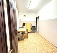 Interior with wooden paneling and flooring in warehouse and hall spaces.