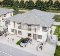 Exterior of a 3-room apartment in Lužianky with parking and green landscaping.