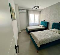 Double room with upholstered beds in the Holiday Apartment.