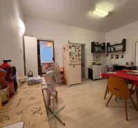 Dining room in a family house with furniture, table, and decorations.