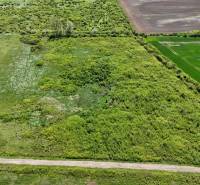 Aerial view of agricultural and forest lands around Zemplínske Kopčany.