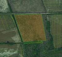 Aerial view of agricultural and forest land in Zemplínske Kopčany with visible parcels.