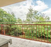A balcony with a view of the green exterior in a 2-room apartment, Mierová Street, Bratislava - Ružinov.
