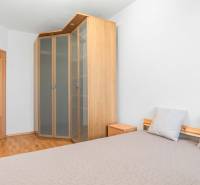 2-room apartment with a built-in wardrobe, bed, and nightstand.