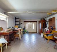 Interior of a family house with a workshop, various tools, and storage items.