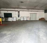 Warehouse on Railway Street: interior with a pallet truck and packages, storage space.