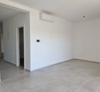 A bright room in a 3-room apartment with tiles and air conditioning.