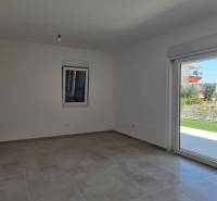 A bright room with a ceramic floor, garden view, and a large window, 3-room apartment.