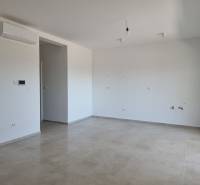 A spacious room in a 4-room apartment with tiles and air conditioning.