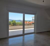 A room in a 4-room apartment with a view of the terrace and nature.