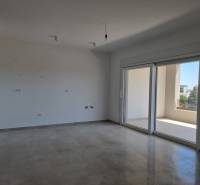 A spacious room in a 4-room apartment with large windows and a balcony.