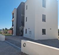 Exterior of a 4-room apartment in Vodice with modern architecture and an adjacent garden.