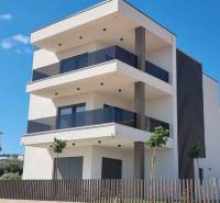Exterior of a 4-room apartment in the city of Vodice, a modern building with spacious terraces.