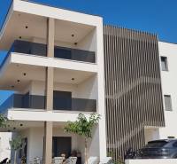 A modern three-story building in the Vodice area, with 4-room apartments and terraces.
