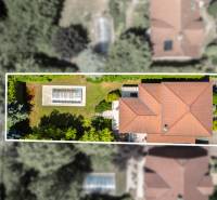 A top-down view of a family house with a swimming pool on Malokarpatská Street in Limbach.