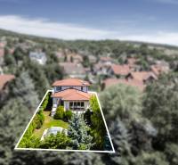 A family house on Malokarpatská Street in Limbach surrounded by greenery and neighboring houses.