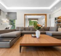 Living room in a family house with a comfortable sofa and a wooden coffee table.