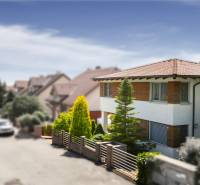 A family house in Limbach on Malokarpatská Street with surroundings full of greenery.