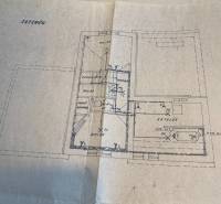 Basement plan of a family house with a boiler room, storage rooms, and a toilet.