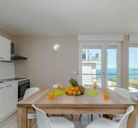 Dining table with fruit in a Holiday Apartment with sea view.