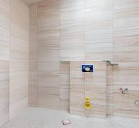 Bathroom tiles and preparation for the installation of sanitary equipment in a family house.