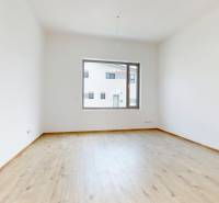 A room with a large window and wooden floor, Family house.