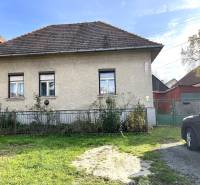 A family house on Partizánska Street in Detva with a garden and an entrance gate.
