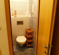 Bathroom with toilet and tiles in a 3-room apartment.
