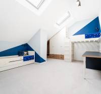 Children's room in a 4-room apartment with a bunk bed and a play corner.