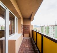 The balcony of a 4-room apartment in the Halalovka housing estate in Trenčín with a view of the apartment buildings.
